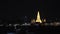 Boat parking passenger Pier Phran NOK in Chao Phraya River Background Wat Arun at night with Light gold is the oldest temple.