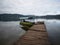 Boat passenger ship vessel waiting at idyllic Amazon rainforest jungle river lake wooden jetty dock pier Tarapoto Peru