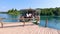 Boat with passengers is approaching to small harbor at Plitvice lakes, Croatia. Tourist travels on