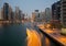 Boat Passing in the Canal of Dubai Marina in the Dusk