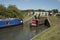 Boat passing through a lock on an English canal UK