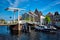 Boat passing under Gravestenenbrug bridge in Haarlem, Netherland