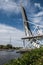 Boat passing under Pegasus Bridge in Normandy