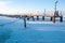 Boat pier on a freezing sunny day all in the snow.