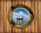 Boat porthole window ship with ocean view and wood background