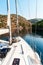 Boat in a quiet bay of Smrka on Brac island, Croatia. Morning in Croatian bay. Holiday on a yacht. Yachting sport. Yacht deck