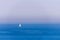 Boat racing across open ocean water. Boat speeding in the sea. Minimal nature photography. Beach view of maritime transportation.