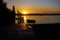 Boat ramp slipway with sunset over the ocean.