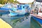 Boat reflection at the port of Eleusis Greece