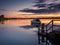 A boat reflects in the still water of the Tauranga harbour waters on a windless night