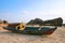 The boat rests on the coast of bangka belitung island at dusk, thin clouds