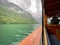 Boat ride over Lake Konigssee in Bayern Germany with hills with forest and clouds above