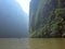 A boat rides down the Sumidero Canyon as sunlight bursts through in the morning in Chiapas State