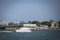 Boat riding through the inlet at Vilano Beach Pier in the inlet in St. Augustine, Florida