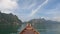 Boat riding through mountain lake at Khaosok National Park, Surat Thani Thailand nature landscape