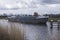 Boat in river Oude IJssel approaches lift bridge