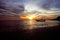 Boat in a romantic beach at sunset