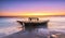 The boat rotting under the purple twilight sky on beautiful beaches