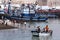 A boat rows through the fishing harbour at Essaouira in Morocco.