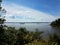 boat ruins in a river with trees and clouds