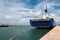 Boat`s Stern and Rope Tied to Bollard in Port