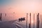 Boat sailing on the canal at sunrise in Burano island, Venice, Italy