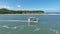 Boat Sailing At Carneiros Beach In Pernambuco Brazil.