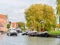 Boat sailing in harbour of old town of Makkum, Friesland, Nether