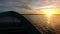 Boat sailing at high speed during sunset in Baja California