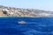 Boat sailing in Mykonos harbour, Greece