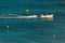 Boat sailing in the ocean near the coast of Lagos, Portugal