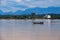 A boat sails in the middle of Mekhong river