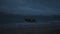 Boat in the sea over cloudy dark sky
