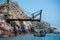 Boat on the sea surface under a wooden structure in the Ballestas islands, Peru