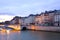 Boat on the Seine River passing by Pont de la Tournelle in Paris