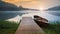 Boat on the serene foggy lake in with the boardwalk in Muskoka Canada in the misty morning