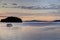 A boat setting out at sunrise in the Gulf Islands off the shores of Vancouver Island