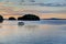 A boat setting out at sunrise in the Gulf Islands off the shores of Vancouver Island