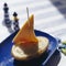 Boat-shaped mashed potato and cheddar appetizer