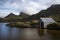 Boat shed on lake with mountain