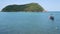 Boat on shore near waving sea. Traditional boat on sunny day on tropical exotic Koh Phangan, Thailand. Paradise Koh Ma Island