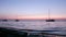 Boat silhoette at dawn in Ria Formosa. Algarve