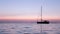 Boat silhoette at dawn in Ria Formosa. Algarve