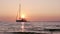 Boat silhoette at sunset in Ria Formosa. Algarve