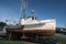 Boat sits in drydock at Winchester Bay OR