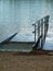 Boat slipway partially submerged at dusk