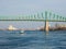 Boat on St-Lawrence river with the Jacques-Cartier bridge in background. Winter time