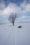 Boat stand on snowy lake and have a blue sky with white clouds