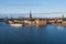 Boat staying at Lake MÃ¤laren near island in the old town in Stockholm, Sweden