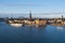 Boat staying at Lake MÃ¤laren near the Riddarholmen Church in Stockholm, Sweden